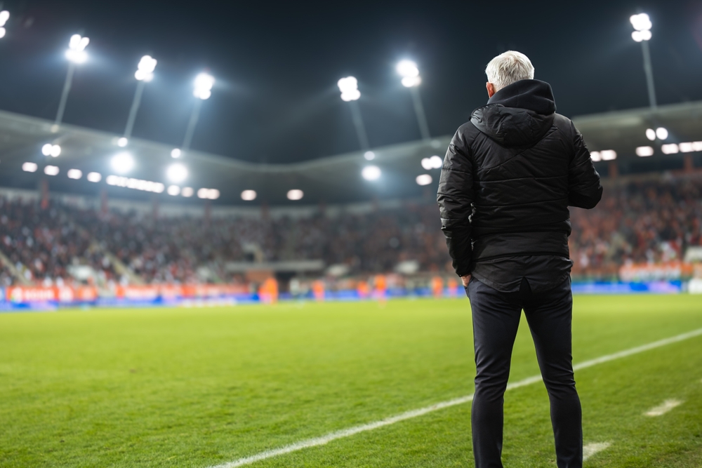 Head,Coach's,Back,And,Soccer,Match,At,The,Stadium,In
