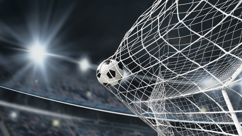 Soccer,Ball,In,Soccer,Goal,Net,.,Close up,Textured,Soccer